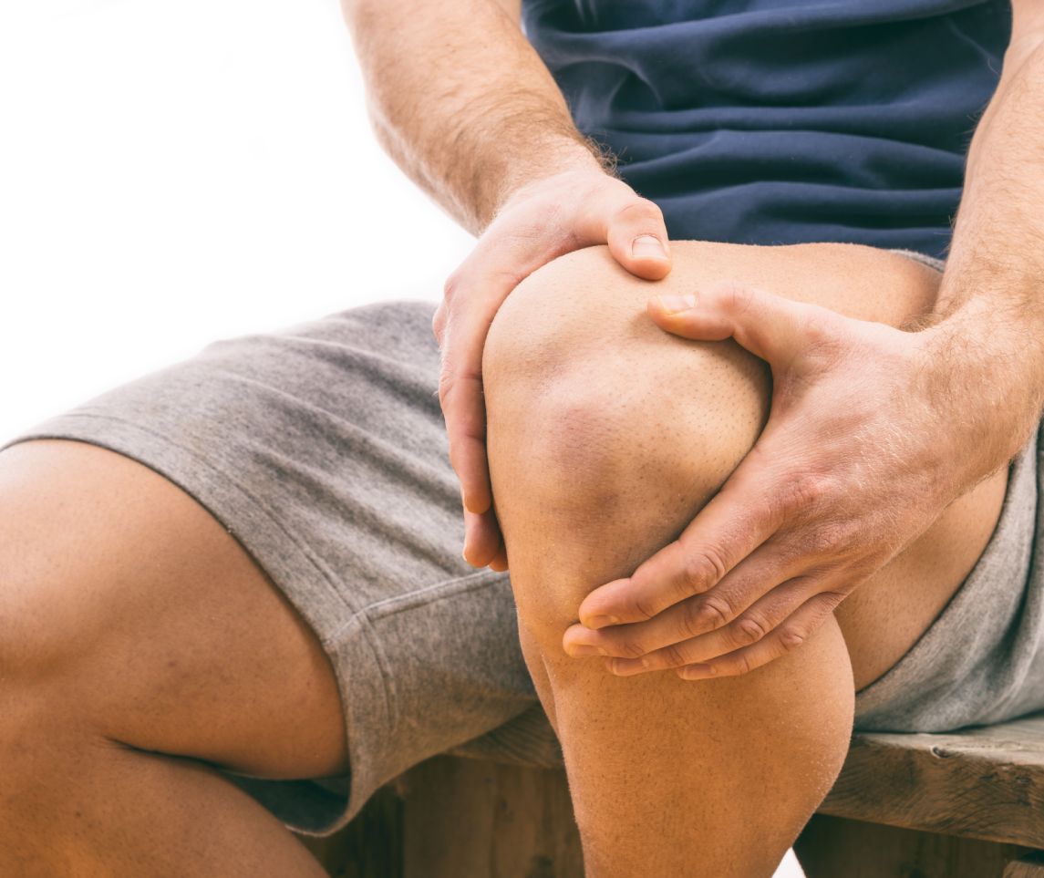 Man with knee pain over white background