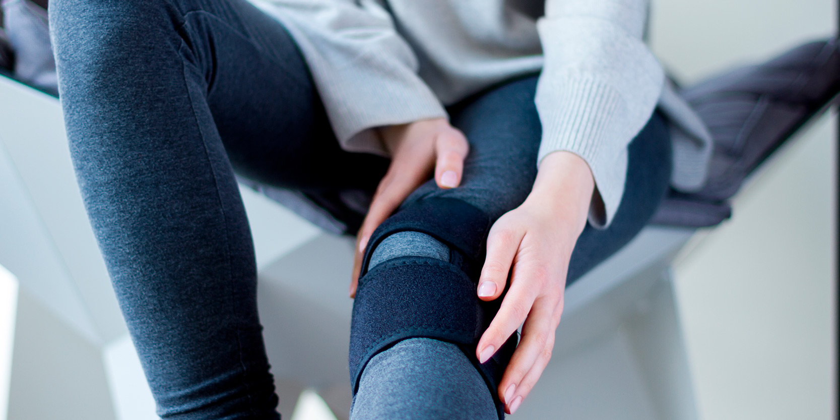 a woman holding her knee