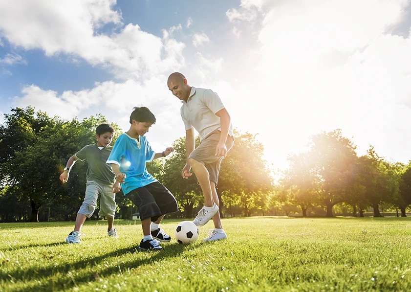 a man playing with his kids