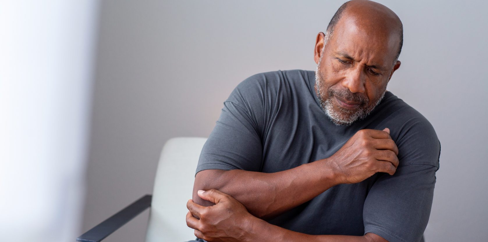 Older man having joint pain.