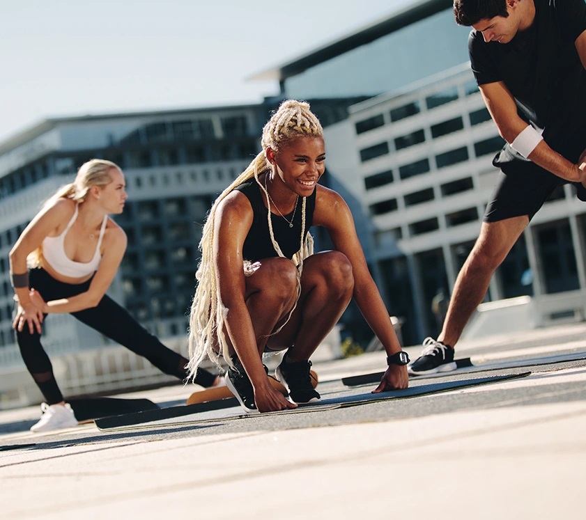 a group of man and women exercising