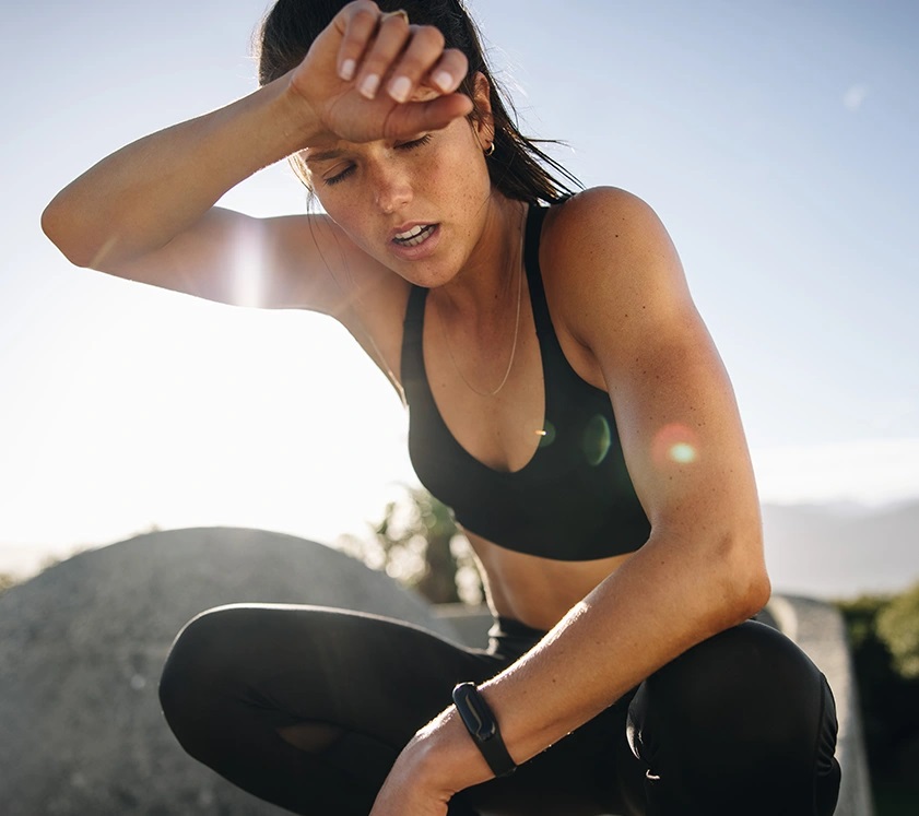 woman catching her breath after a physical activity