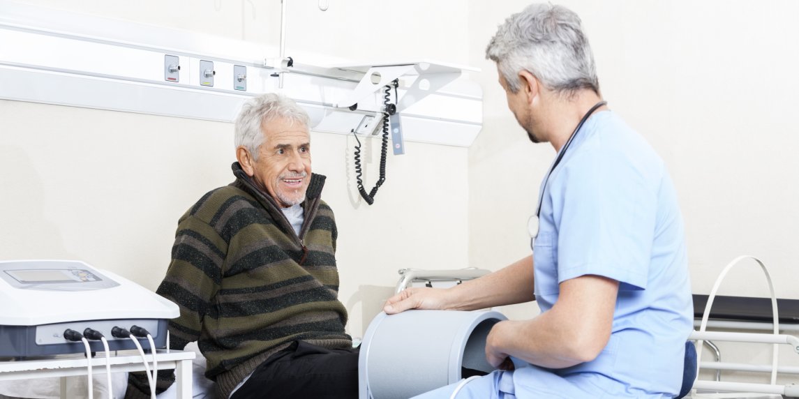 Senior Patient Receiving Electromagnetic Chiropractic Care